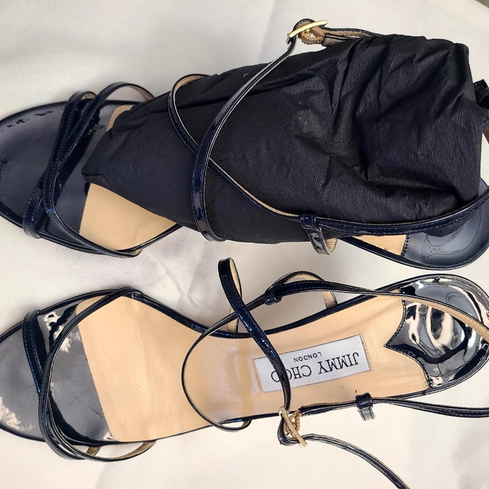 Jimmy Choo black cross front patent leather shoes.  Heel 4 inches